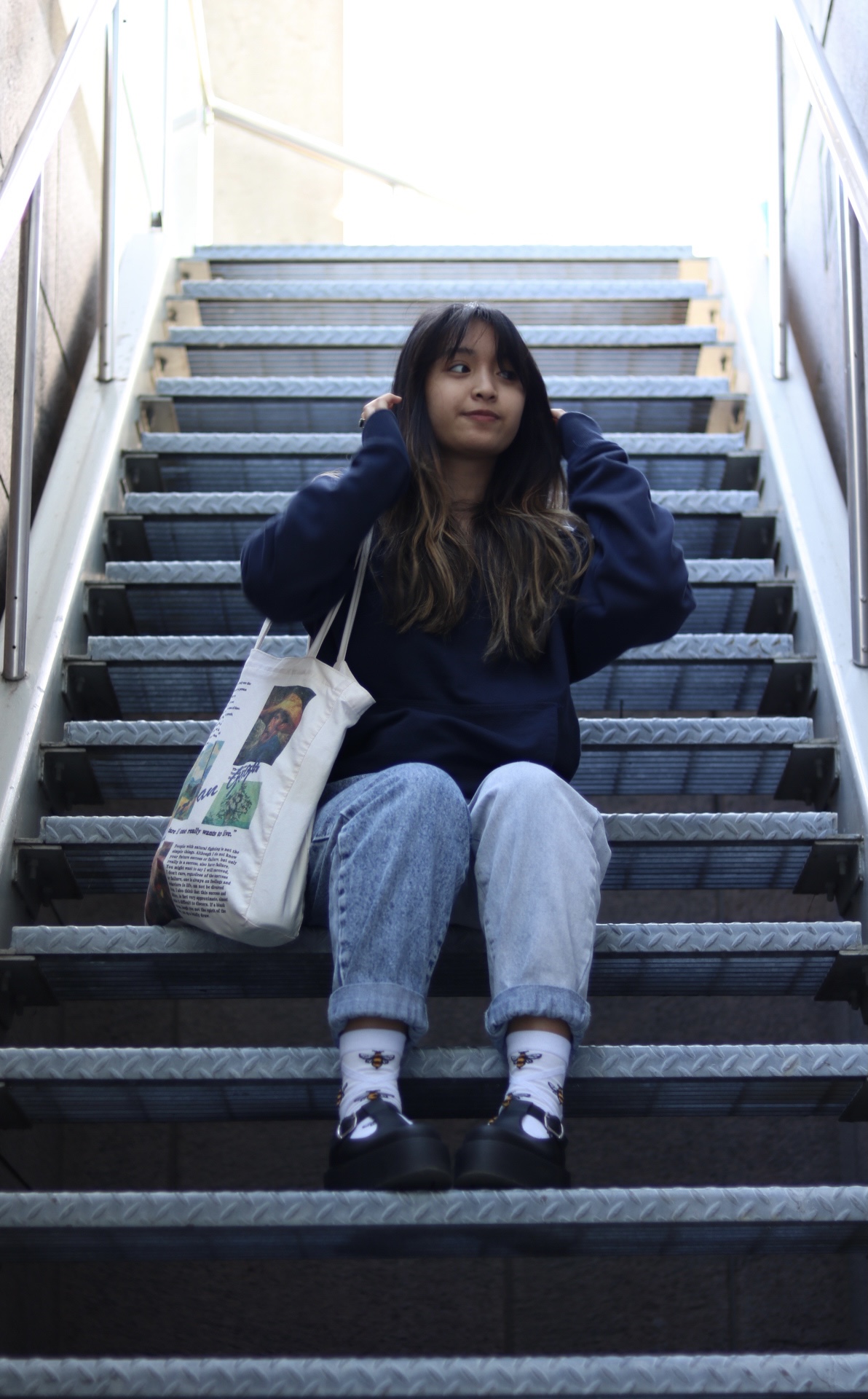 a girl posed on a staircase