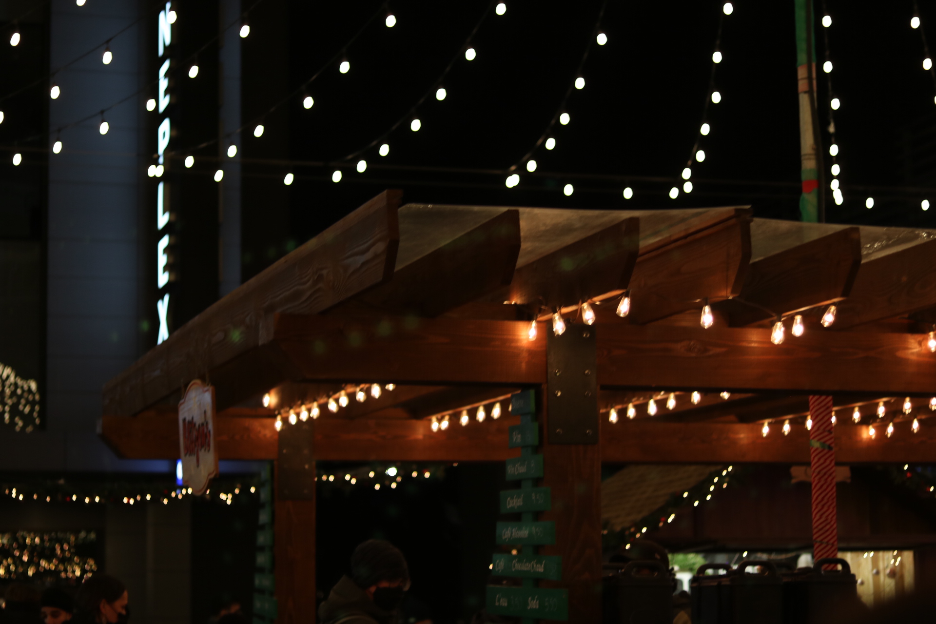 A wooden roof, with lights strung above