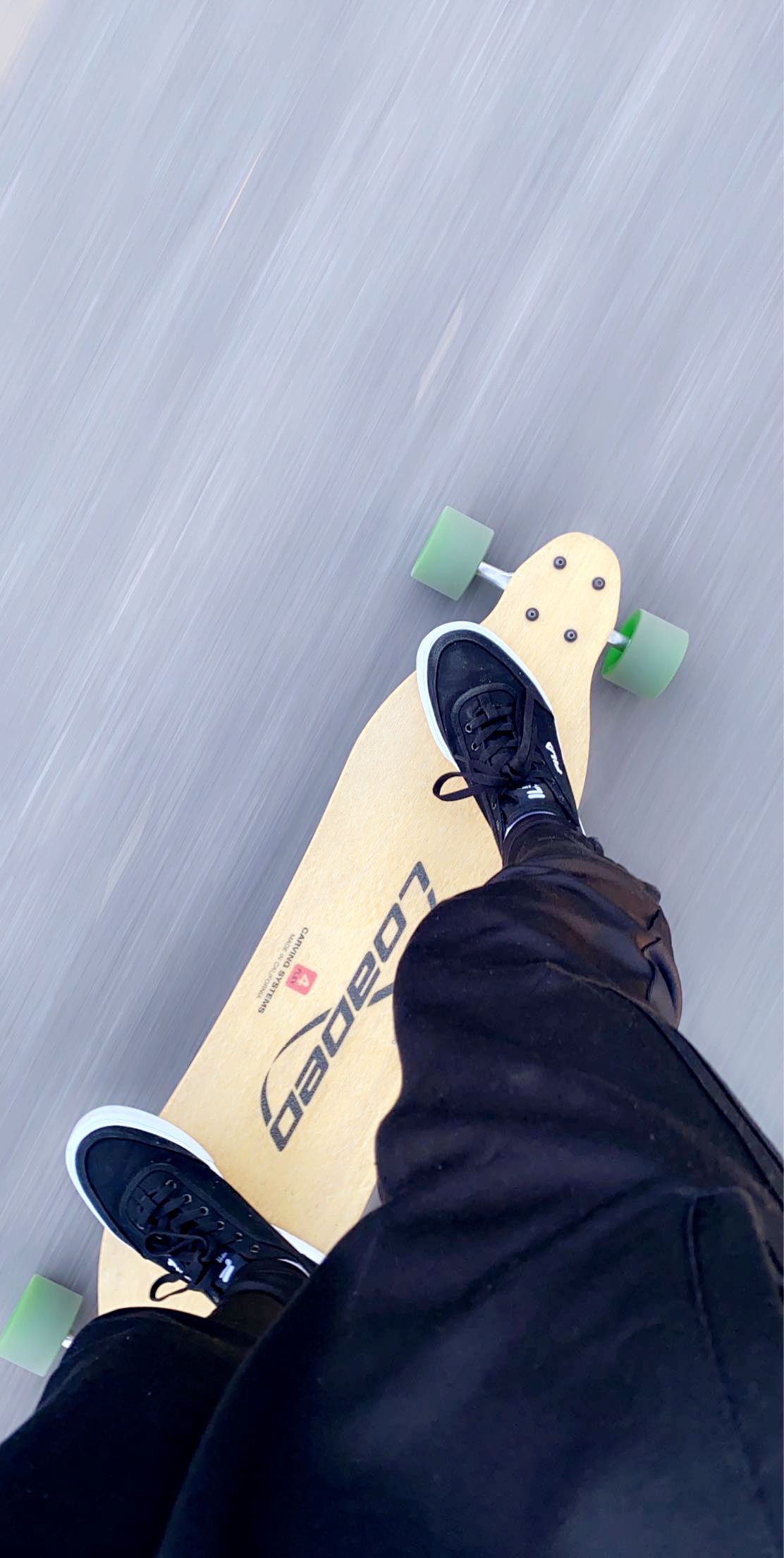 A man riding his longboard